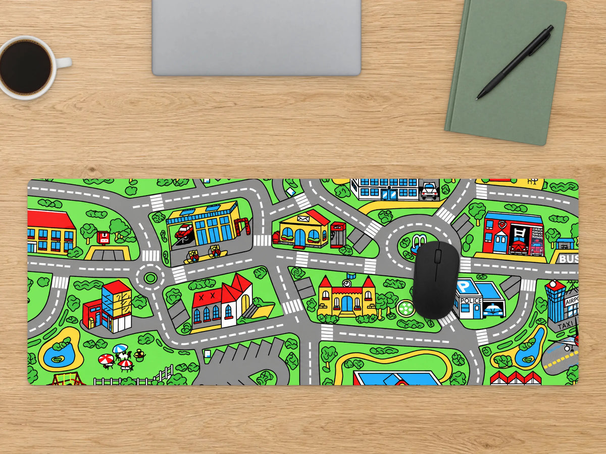 Childhood Mat on a light oak desk with a mouse, a closed laptop, a notebook and coffee